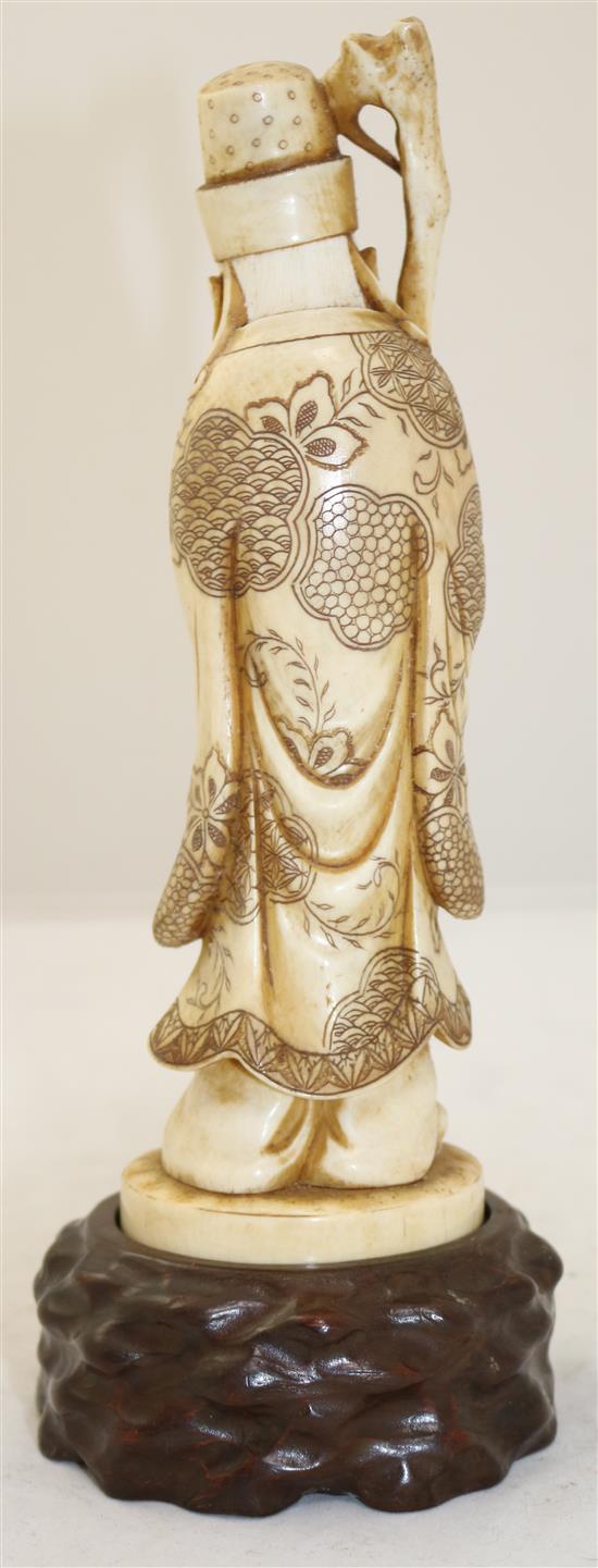 A Japanese ivory figure of a sage, early 20th century, height 25.5cm including wood stand